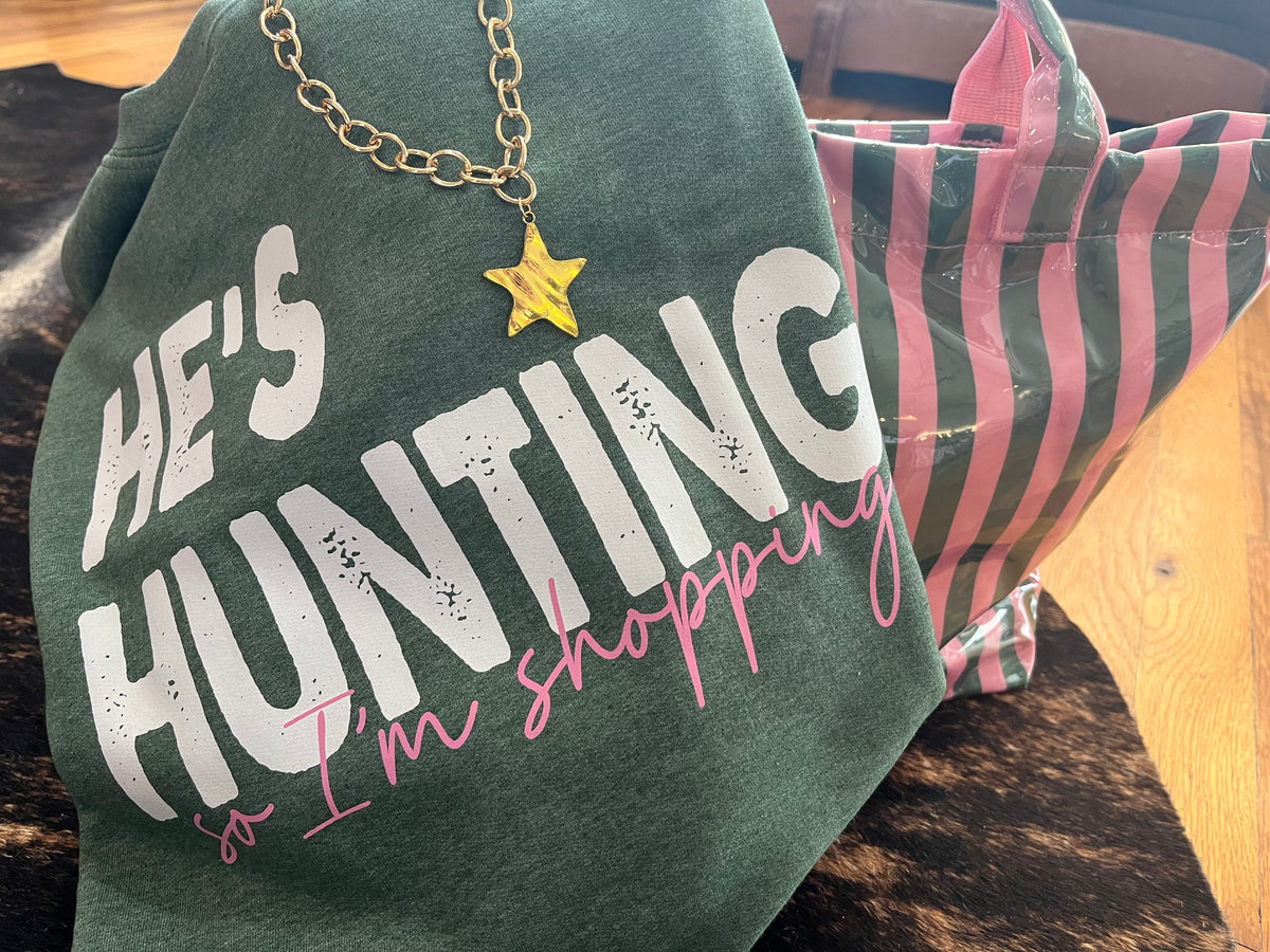 He’s hunting, I’m shopping