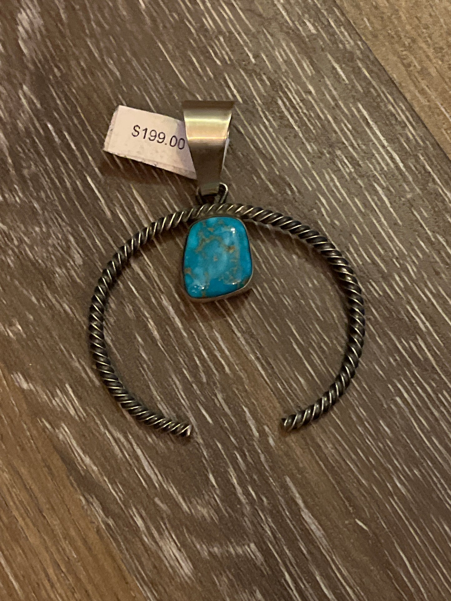 Twisted squash blossom with turquoise stone