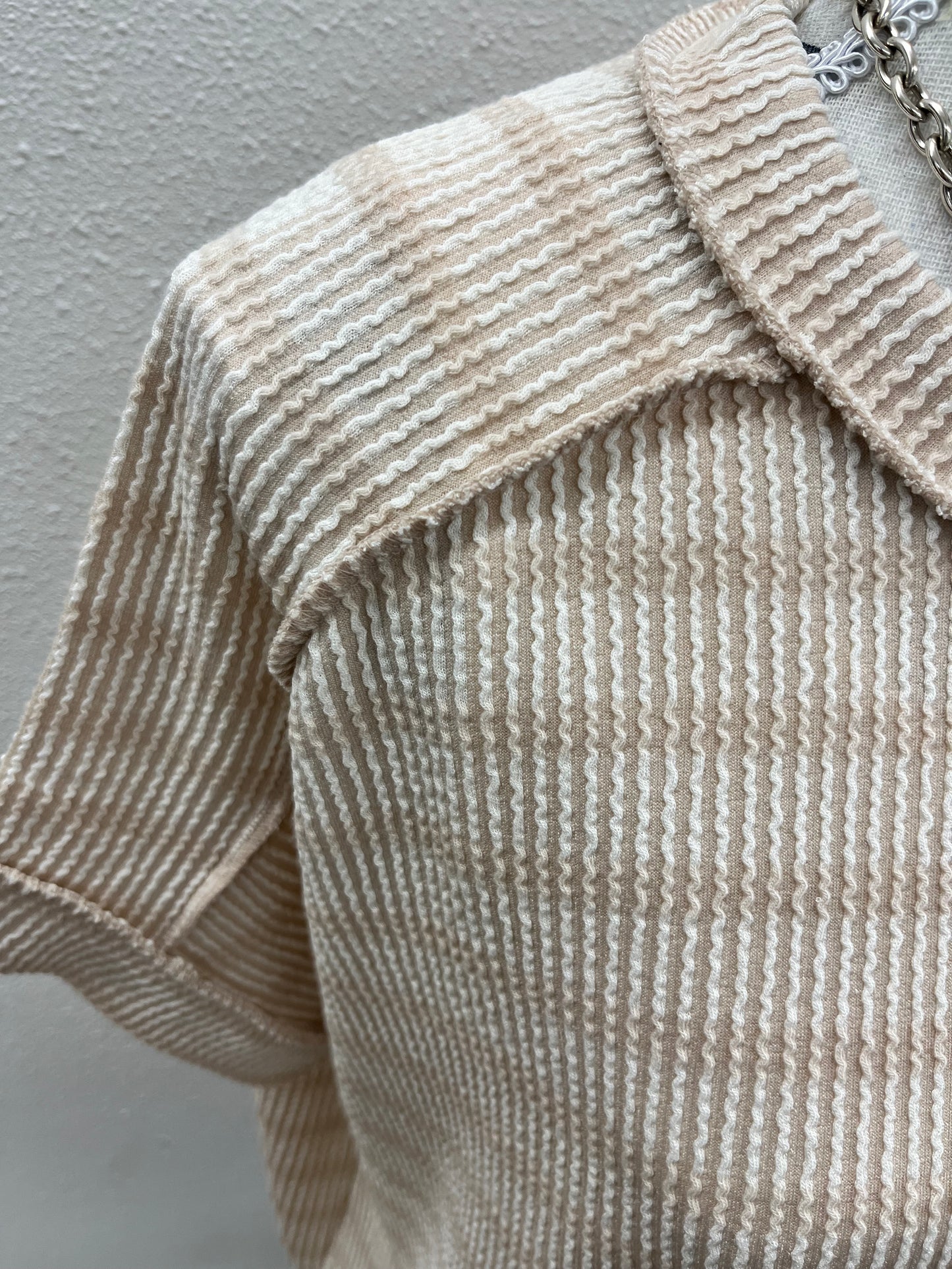 Raised rib striped exposed seam top