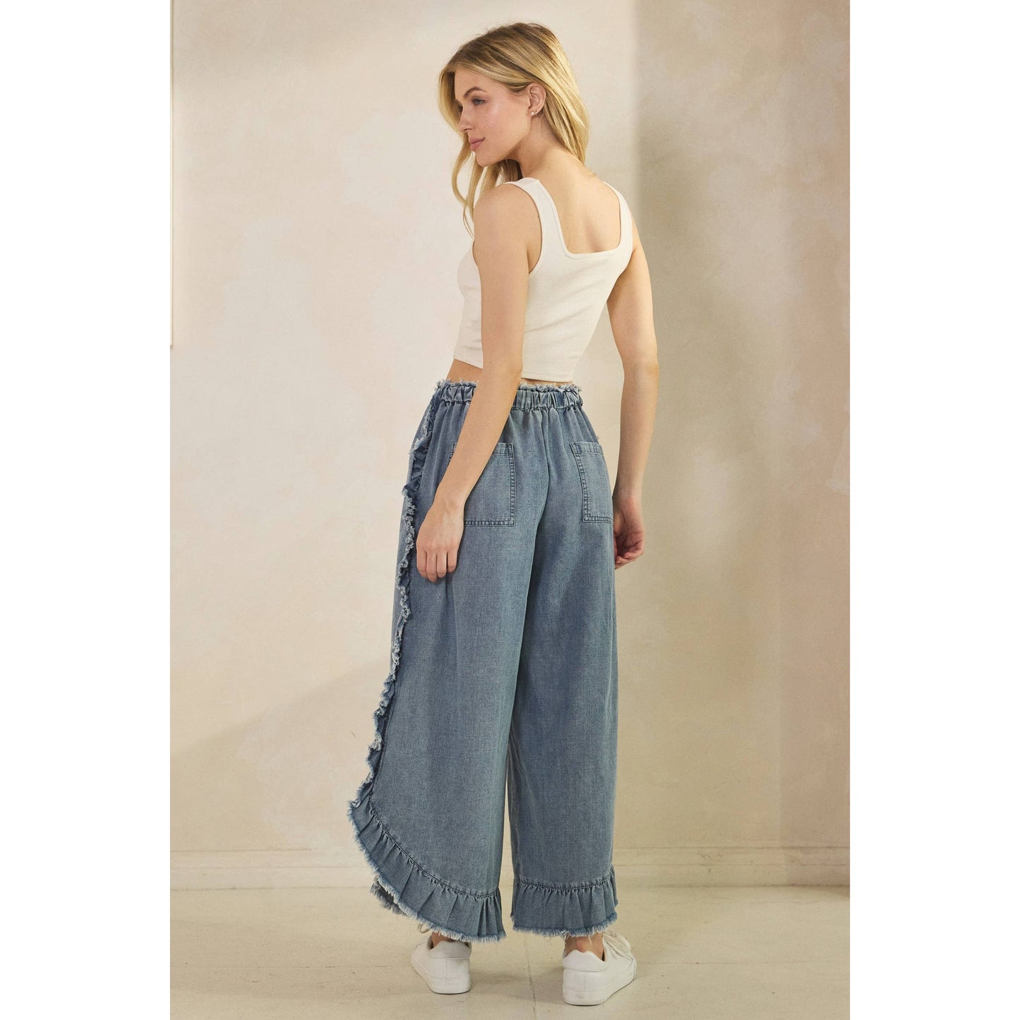 FRAYED RUFFLE HEM DENIM PANTS