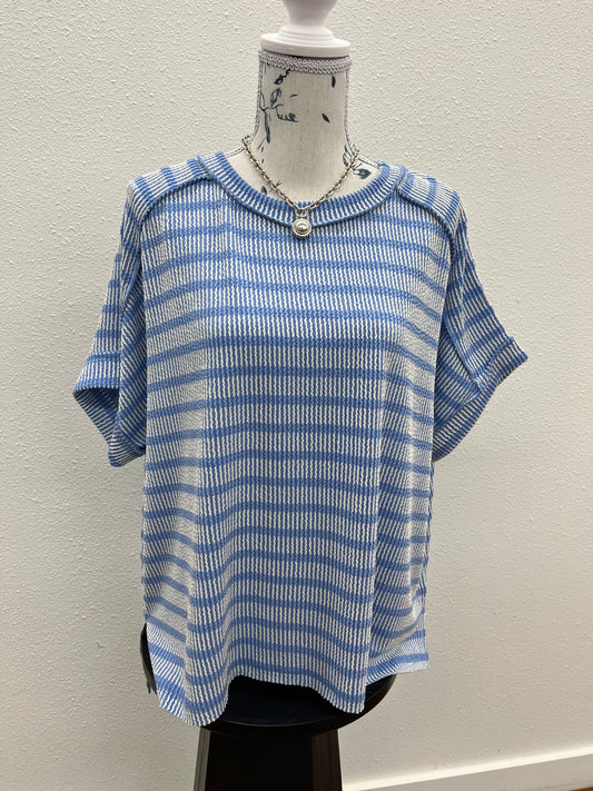 Raised rib striped exposed seam top