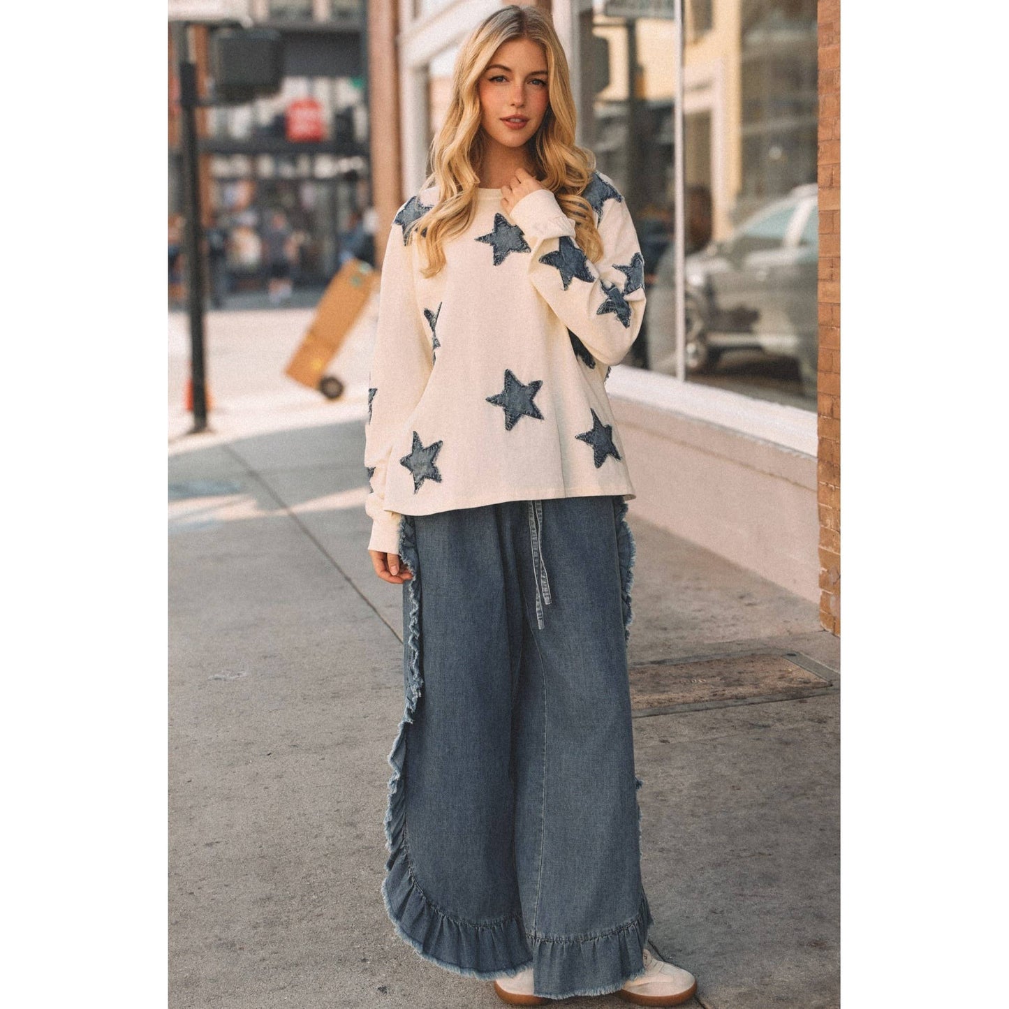 FRAYED RUFFLE HEM DENIM PANTS