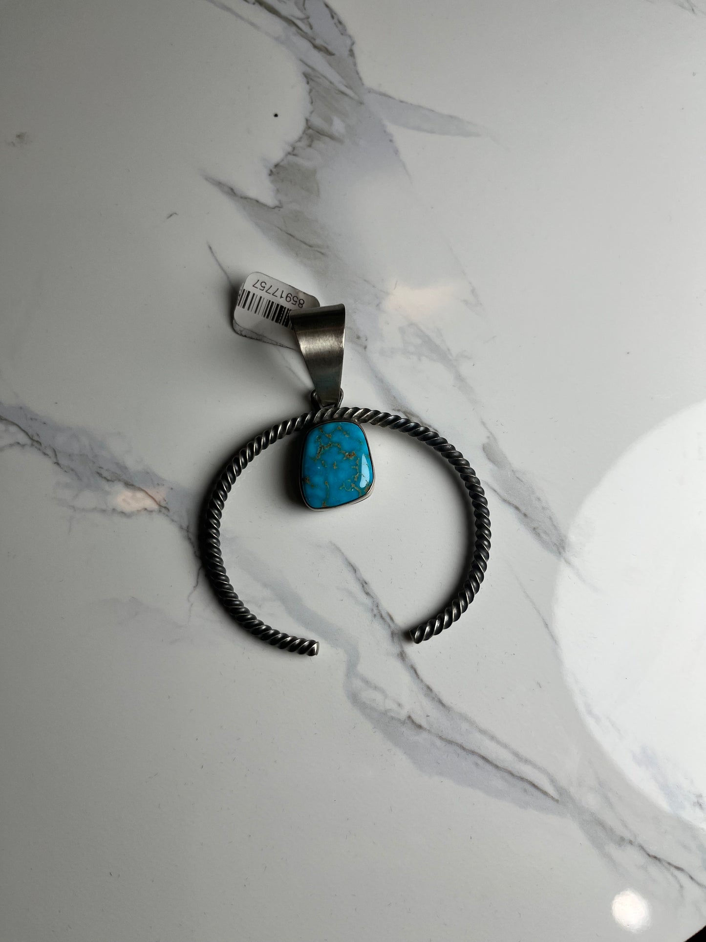 Twisted squash blossom with turquoise stone