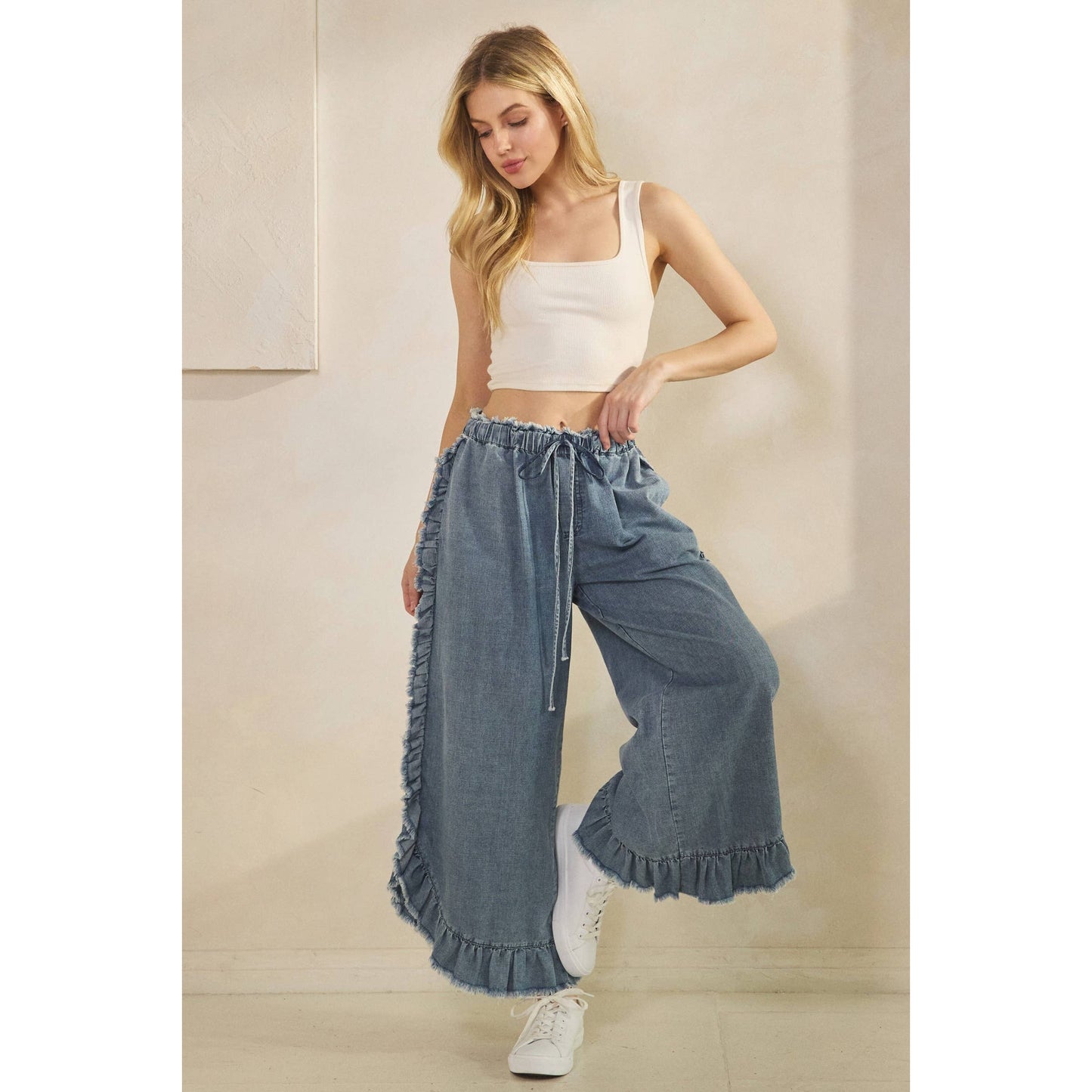 FRAYED RUFFLE HEM DENIM PANTS