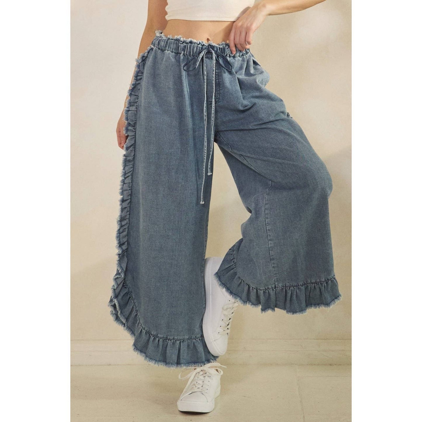 FRAYED RUFFLE HEM DENIM PANTS