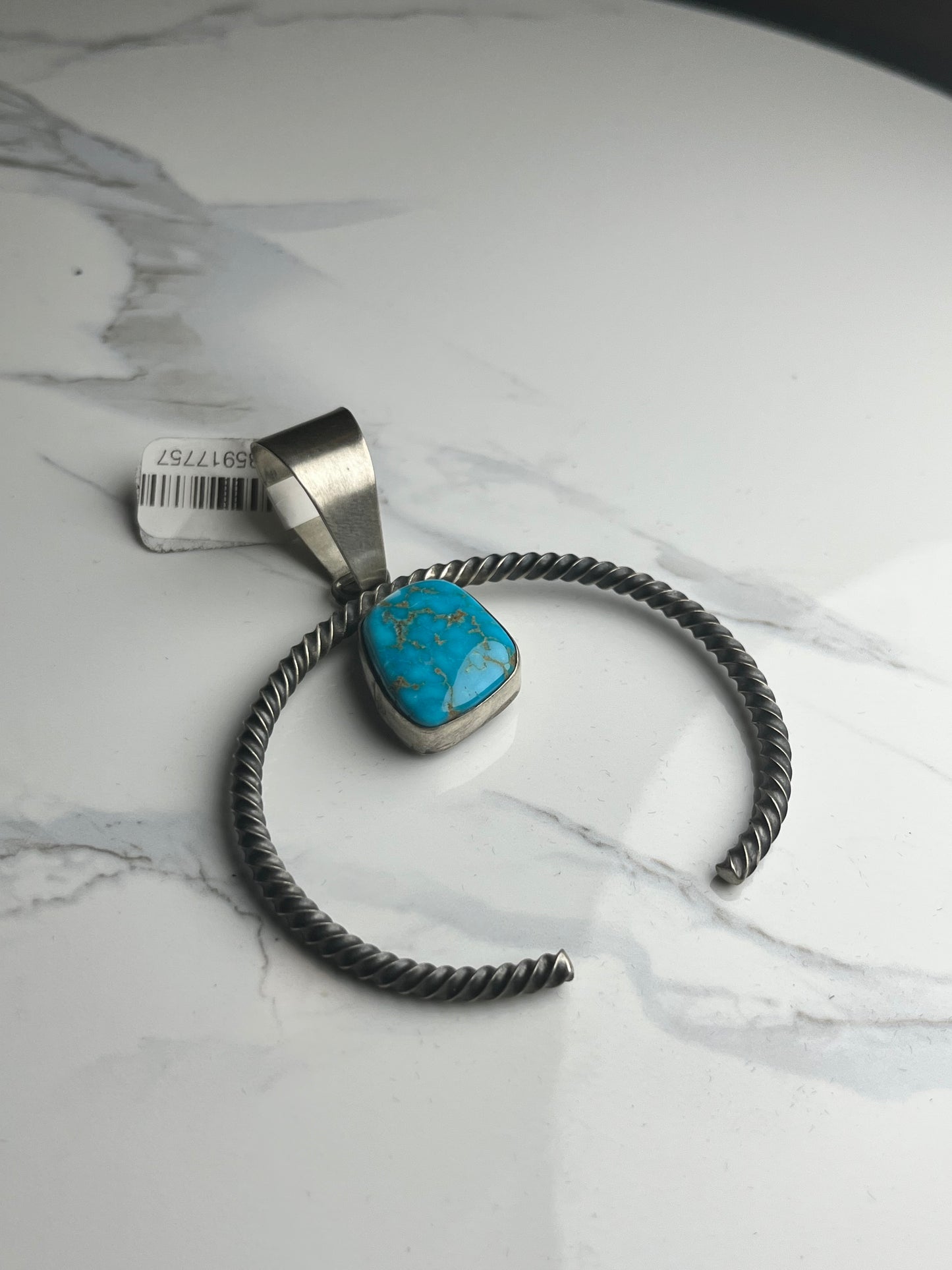 Twisted squash blossom with turquoise stone