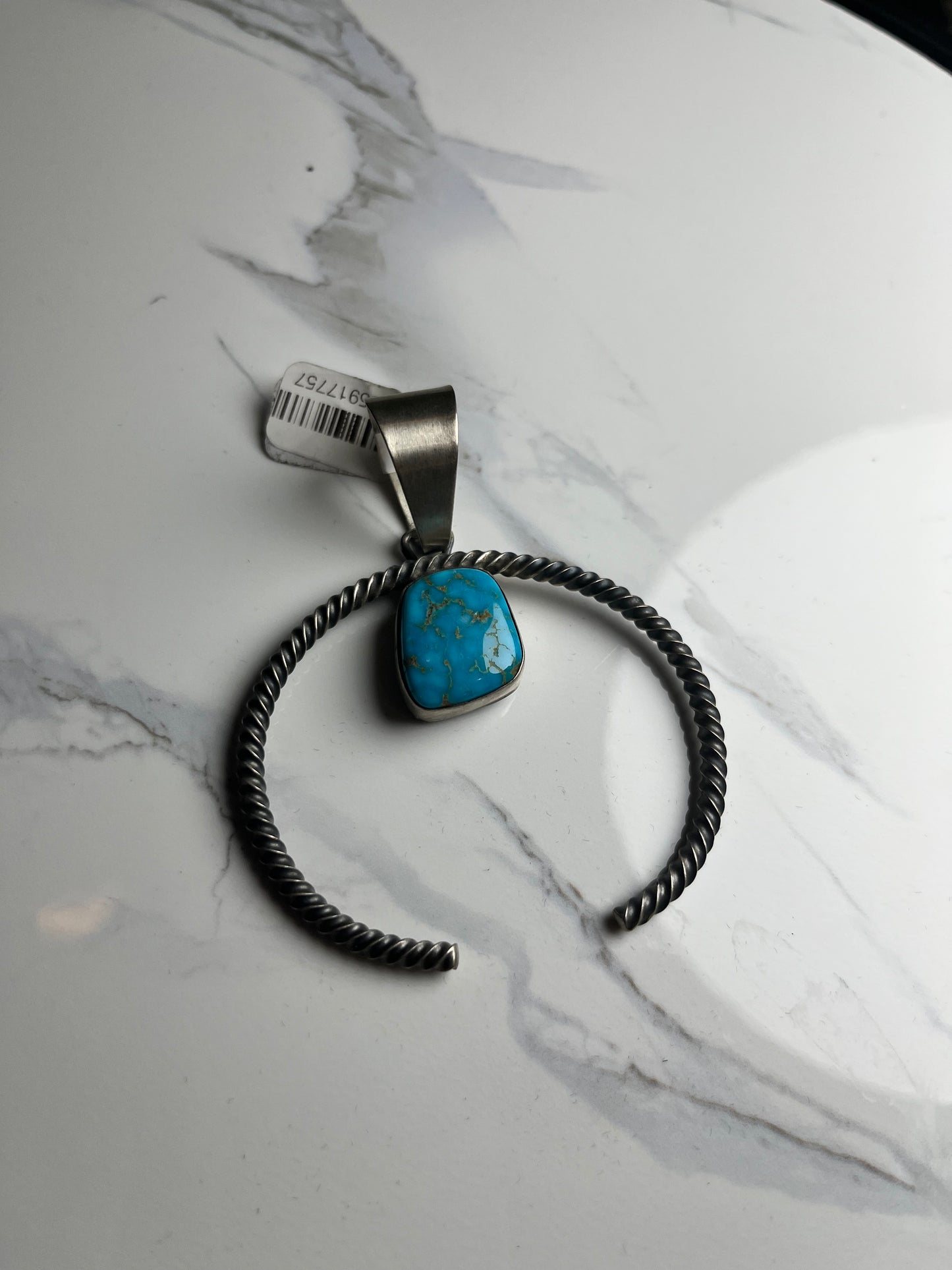 Twisted squash blossom with turquoise stone