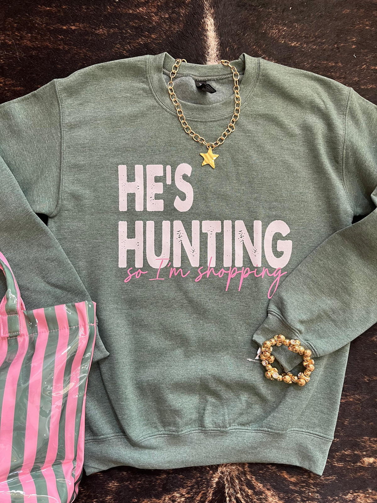 He’s hunting, I’m shopping