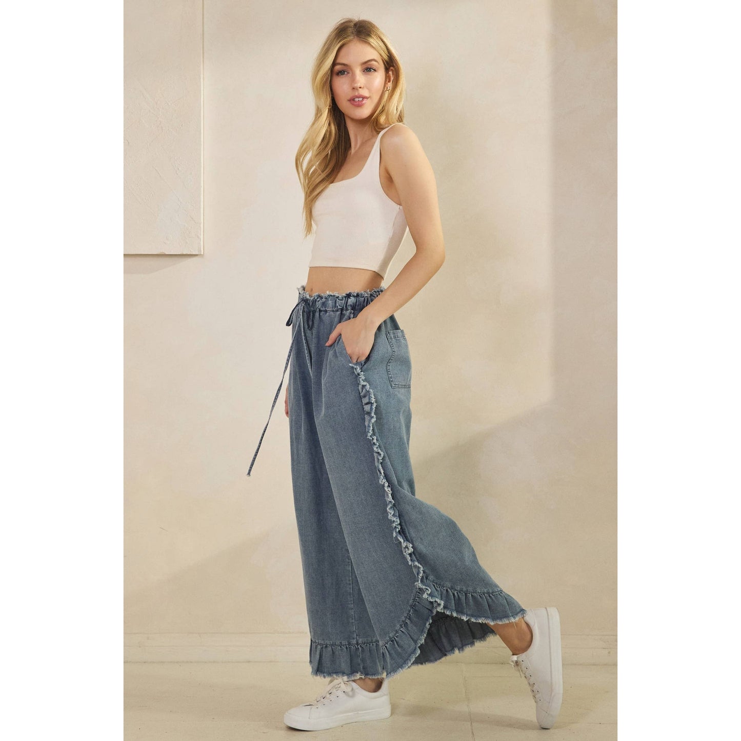FRAYED RUFFLE HEM DENIM PANTS