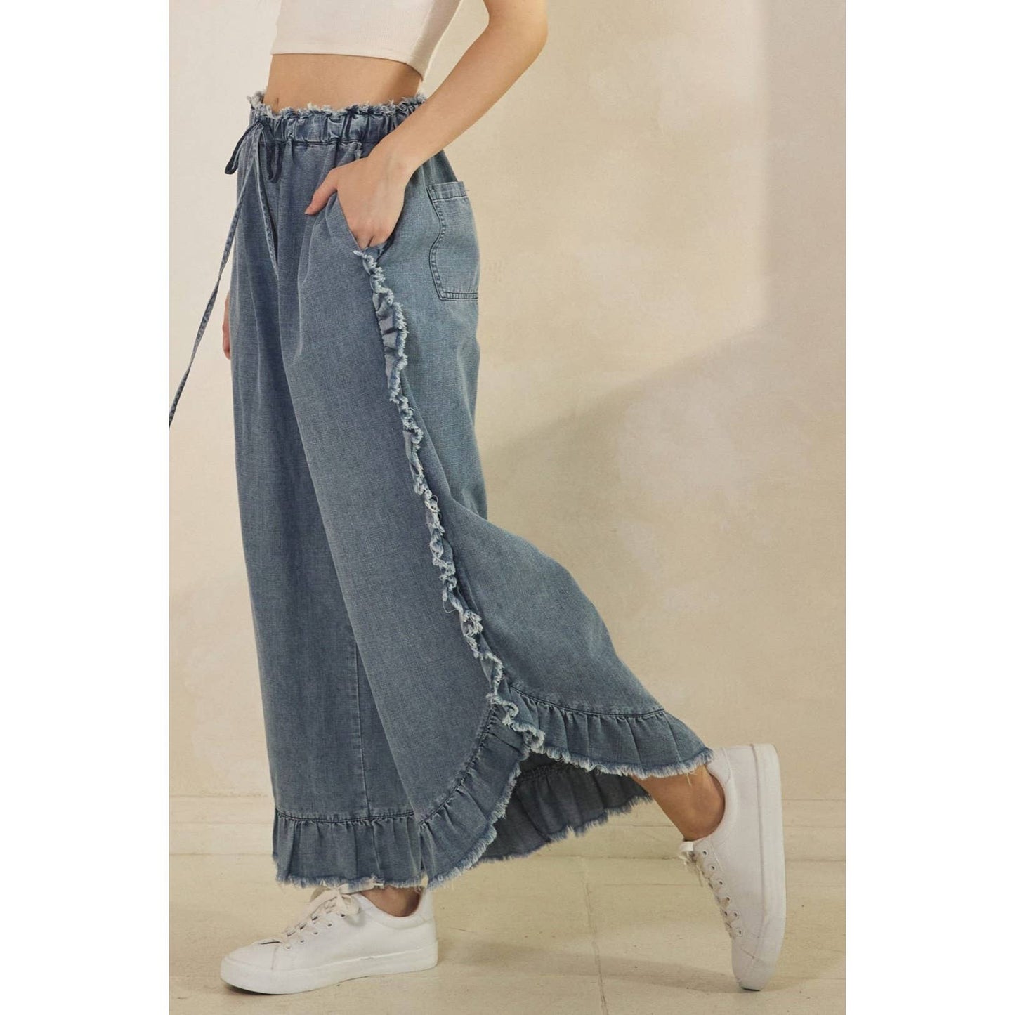FRAYED RUFFLE HEM DENIM PANTS